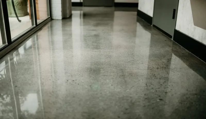 Polished concrete hallway floor by the Ascent Epoxy team