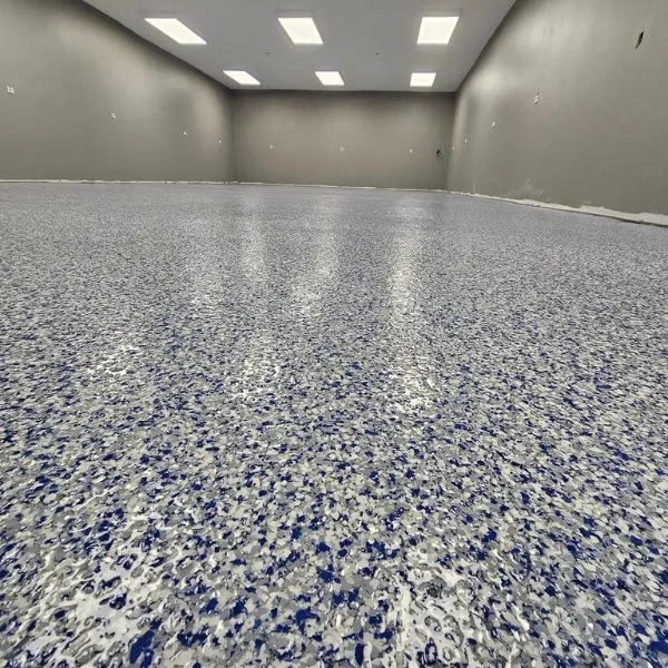 Open commercial space blue and gray flake epoxy floor by the Ascent Epoxy team